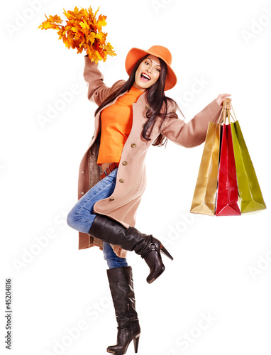 Photo: Woman holding orange leaves. Woman holding orange leaves.