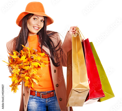 Photo: Woman holding orange leaves. Woman holding orange leaves.