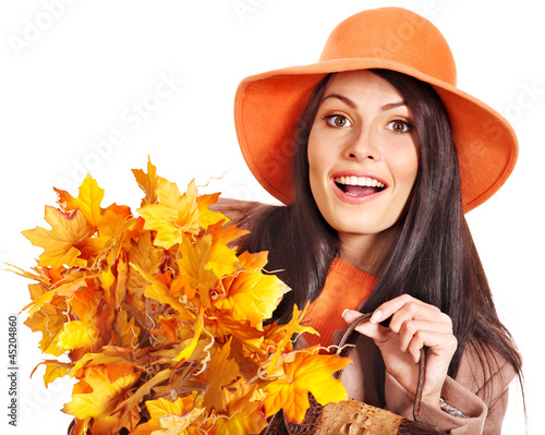 Photo: Woman holding orange leaves. Woman holding orange leaves.