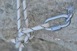 Carbine and hook with rope in stone