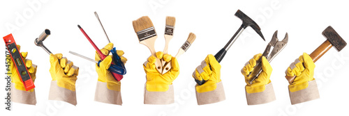 Photo: Arbeitshandschuhe mit Werkzeug freigestellt Arbeitshandschuhe mit Werkzeug freigestellt