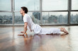 Young Man Practicing Yoga At Gym