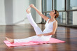 Young Woman In Heron Pose At Gym