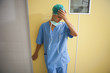 Nurse in scrubs looking worried