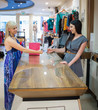 Photo: Woman paying with credit card Woman paying with credit card