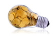 Foto: Traditional light glass bulb with many golden coins Traditional light glass bulb with many golden coins