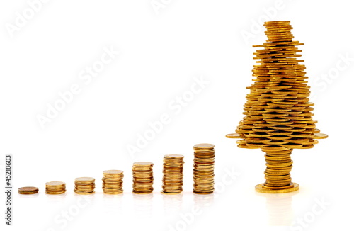 Photo: Happy Christmas tree made of gold coins, business metaphor Happy Christmas tree made of gold coins, business metaphor