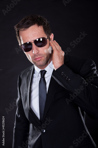 Photo: Portrait Of Young Man With Earphone Portrait Of Young Man With Earphone