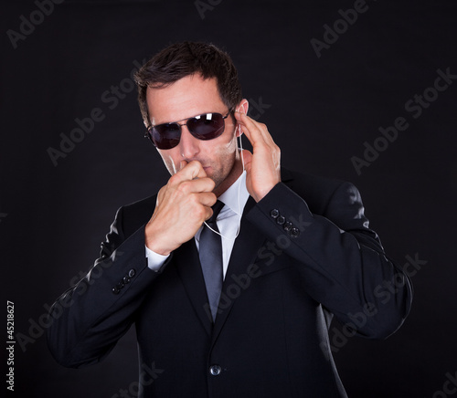 Photo: Portrait Of Young Man With Earphone Portrait Of Young Man With Earphone