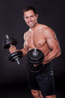Young Attractive Man Pumping Weights