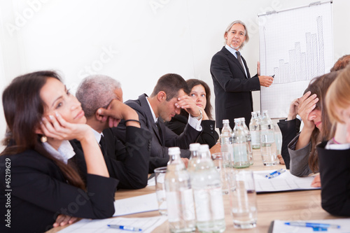 Photo: Portrait Of Sad Business Team Portrait Of Sad Business Team