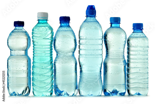 Photo: Polycarbonate plastic bottle of mineral water isolated on white Polycarbonate plastic bottle of mineral water isolated on white