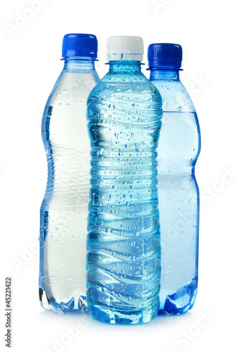 Photo: Polycarbonate plastic bottle of mineral water isolated on white Polycarbonate plastic bottle of mineral water isolated on white