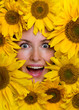 Happy young woman with sunflowers