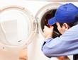 Technician repairing a washing machine