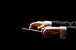 Concert conductor hands with a baton