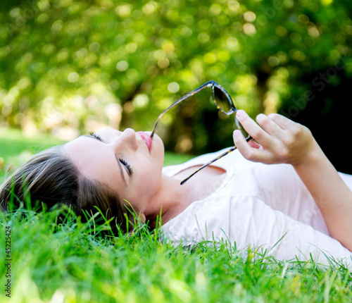 Photo: Thoughtful woman at the park Thoughtful woman at the park