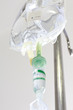 iv bag hanging on a metal pole