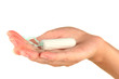 woman's hand holding a clean cotton tampon