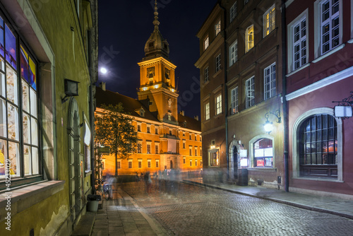 Photo: Old Town street at night with view to Royal Palace in Warsaw Old Town street at night with view to Royal Palace in Warsaw