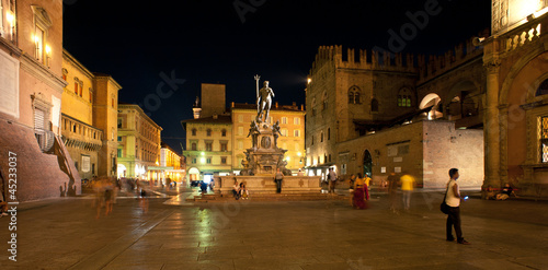 Photo: People walking in Nettuno square, Bologna. Italy. People walking in Nettuno square, Bologna. Italy.