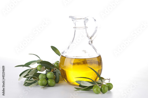 Photo: olive oil and branch olive oil and branch