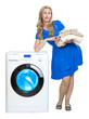 The happy young woman near the new washing machine..