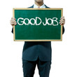 Business man holding blackboard on the background , Good job