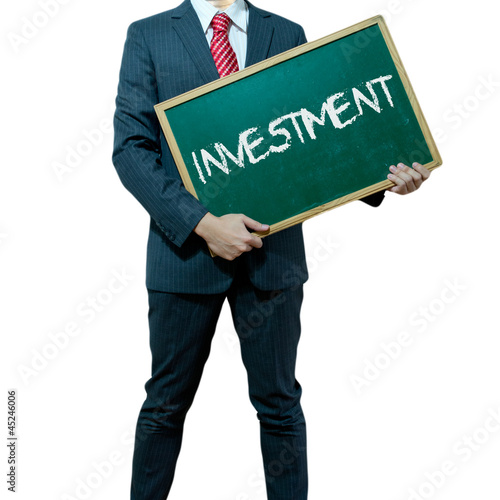 Photo: Business man holding board on the background with business word Business man holding board on the background with business word