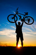 cyclist with a bike silhouette on a blue sky