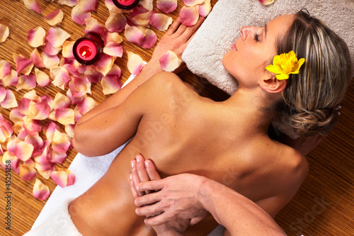 Photo: Young woman in Spa massage salon. Young woman in Spa massage salon.