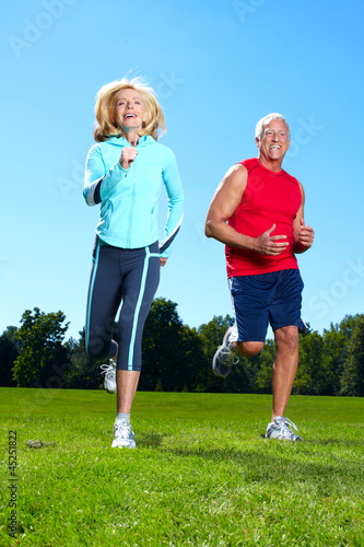Photo: Happy jogging couple. Happy jogging couple.