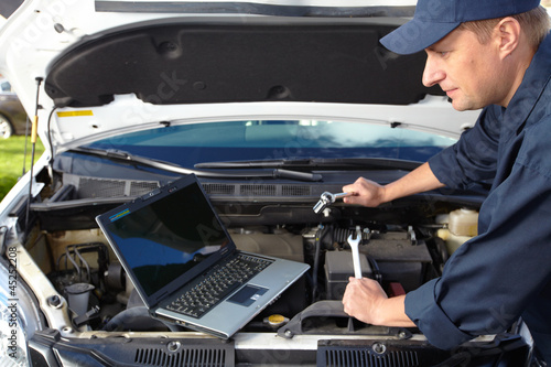 Photo: Car mechanic. Car mechanic.