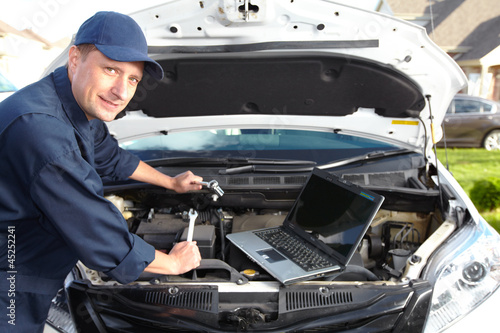 Photo: Car mechanic. Car mechanic.