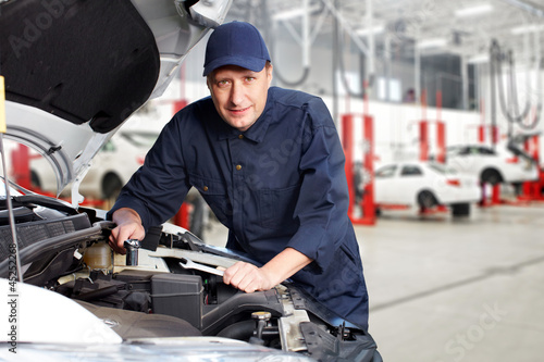 Photo: Professional auto mechanic. Professional auto mechanic.
