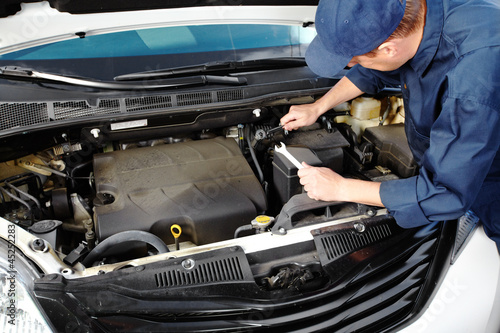 Photo: Professional auto mechanic. Professional auto mechanic.