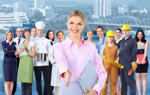 Photo: Business woman and Group of industrial workers. Business woman and Group of industrial workers.