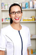 Young woman in pharmacist uniform