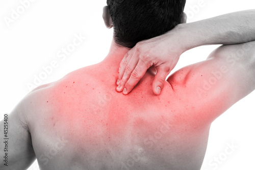 Photo: Young man with back pain, isolated on white Young man with back pain, isolated on white