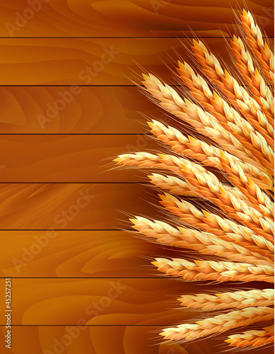 Vector: Ears of wheat on wooden background. Vector. Ears of wheat on wooden background. Vector.