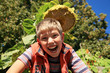 Happiness boy under sunflower.
