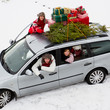 Photo: Christmas - family in car with gifts &christmas tree Christmas - family in car with gifts &christmas tree