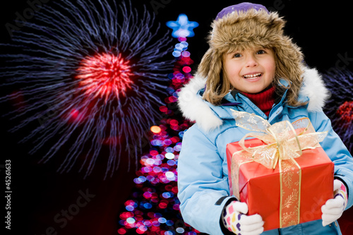 Photo: Christmas night, lovely girl is celebrating Christmas Christmas night, lovely girl is celebrating Christmas