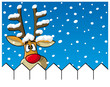 Reindeer behind fence with snowflakes