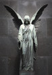 Monument of old angel on cemetery in Warsaw