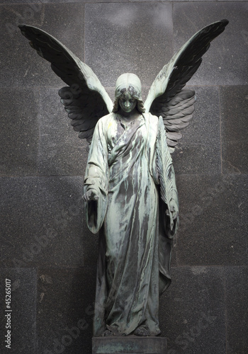 Photo: Monument of old angel on cemetery in Warsaw Monument of old angel on cemetery in Warsaw