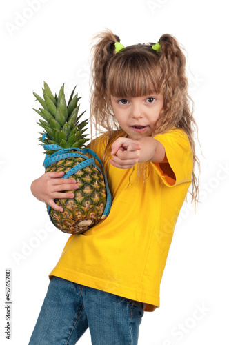 Photo: Little girl with pineapple Little girl with pineapple