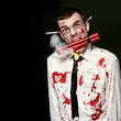 Zombie Suicide Bomber Holding Explosives In Mouth