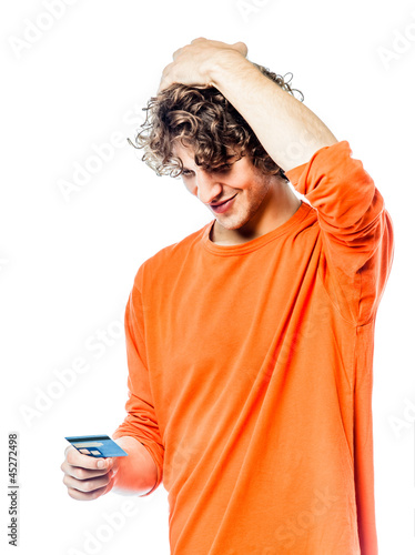 Photo: young man holding credit card portrait young man holding credit card portrait