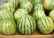 Photo: Big watermelon market display in a row Big watermelon market display in a row